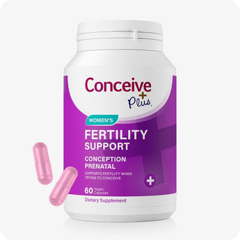 For Conceive Plus Maximum Fertility Bundle, image of women’s fertility support supplement in vibrant purple packaging, labeled for conception and prenatal use, with two pink vegan capsules placed beside bottle to emphasize form and dosage.